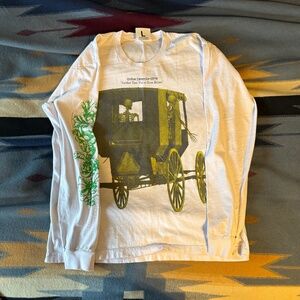 White Long Sleeve Graphic Tee with Yellow Carriage and Green Sleeve Accent
